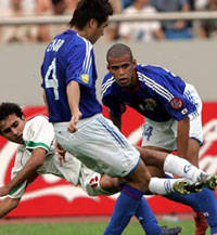 Hossein Kaebi of Iran & Endo, Santos of Japan