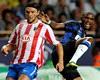 Samuel Eto'o looks a tad unorthodox chasing down Tomas Ujfalusi in the UEFA Supercup (Getty Images)