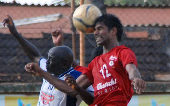 Churchill Brothers' Denzil Franco In The Air Above Viva Kerala's Ayuba Mbwas Mangut