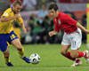 Joe Cole of England vs Mattias Jonson of Sweden (AFP)