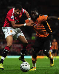 Manchester United's Bebe tussles with Wolves' George Elokobi (Getty Images)