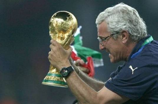 Italy coach Marcello Lippi holds World Cup trophy (AFP)