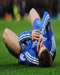 Fernando Torres is knocked to the floor after Daniel Agger's challenge (Getty Images)