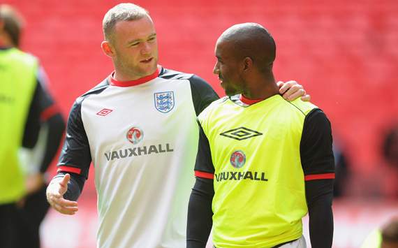 England Training And Press Conference, Wayne Rooney speaks to Jermain Defoe
