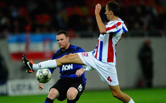 Champions League - FC Otelul Galati v Manchester United FC,Wayne Rooney  and Ioan Filip   