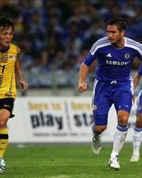 Frank Lampard (R) of Chelsea chases Joseph Kalang of Malaysia during the pre-season friendly match between Malaysia and Chelsea at Bukit Jalil National Stadium on July 21, 2011 in Kuala Lumpur, Malaysia.