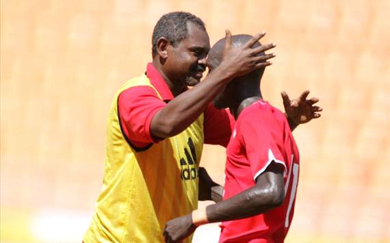 Sudan's Muawia Bashir Koko celebrates with his coach 