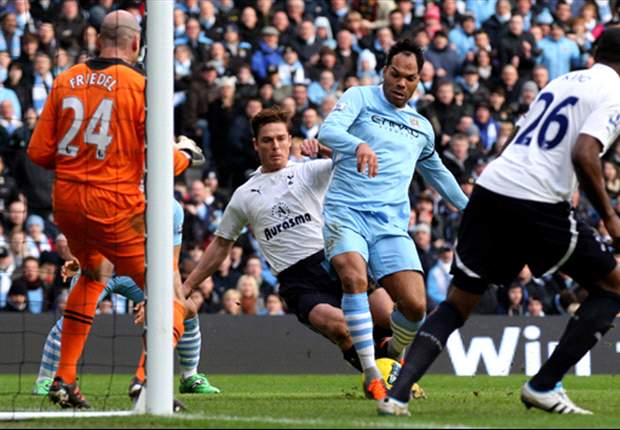 Lescott urges Manchester City fans not to get carried away