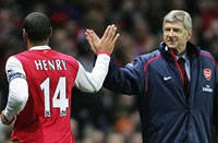 Prem: Henry celebrates with Wenger in Arsenal's 4-0 win over Charlton (AFP)