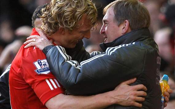 Liverpool Manager Kenny Dalglish embraces Dirk Kuyt at the end of the FA Cup Fourth Round match between Liverpool and Manchester United