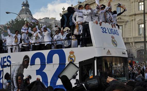 Real Madrid players celebrating at the bus