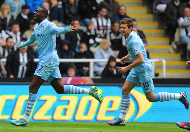 Unstoppable Yaya Toure drives Manchester City to within inches of the Premier League title