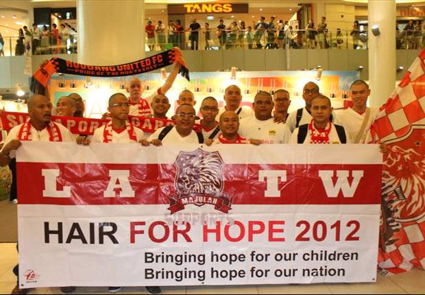 Football fan group raises over $1000 for cancer charity