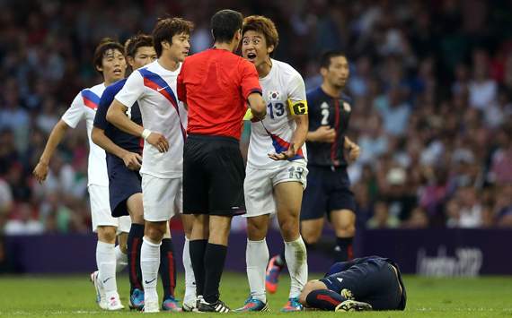 Olympics Day 14 - Men's Football, Korea v Japan, referee Ravshan Irmatov and Jacheol Koo