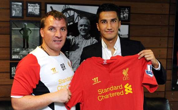 Brendan Rodgers, manager of Liverpool, and Real Madrid's Nuri Sahin