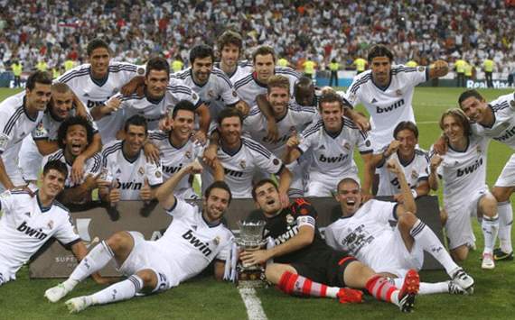 Real madrid players celebrating with spanish supercup