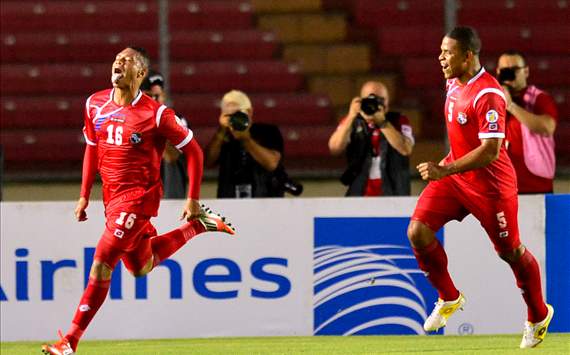 Panama's Rolando Blackburn (L) celebrates with teammate Roman Torres, after scoring against Canada