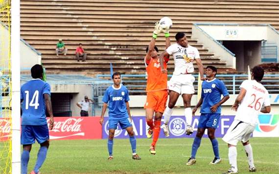 Pailan Arrows Pronoy Halder tries to head the ball past Dempo keeper Subhashish Roychowdhury, Federation Cup 2012