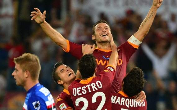 As Roma players celebrate Francesco Totti goal against Sampdoria