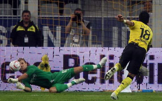 Lucas Barrios of Dortmund shoots a penalty and Joe Hart of Manchester City
