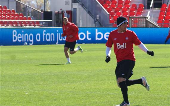 Canada's Iain Hume (front) and Andre Hainault train at BMO Field