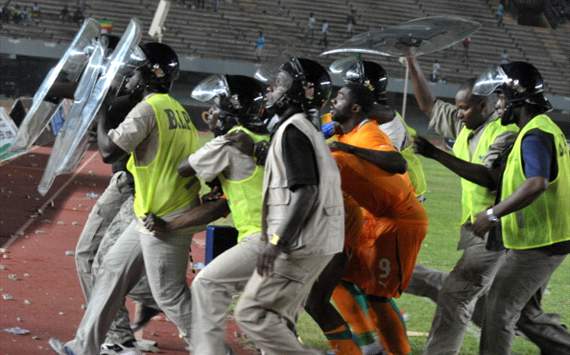 Police protect players at the Leopold Sedar Senghor stadium in Dakar during the Afcon qualifier between Senegal and Cote d'Ivoire