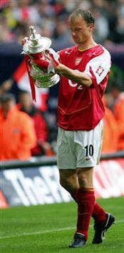 England: Dennis Bergkamp of Arsenal with FA Cup 2005 (AFP)