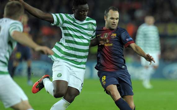 Kenya and Celtic midfielder Wanyama tackles Andrea Iniesta of Barcelona