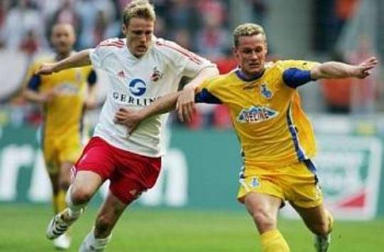 Christian Lell of Cologne against Kurth of MSV Duisburg (AFP)