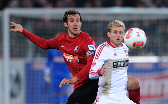 SC Freiburg v Bayer 04 Leverkusen: Julian Schuster & Andre Schürrle