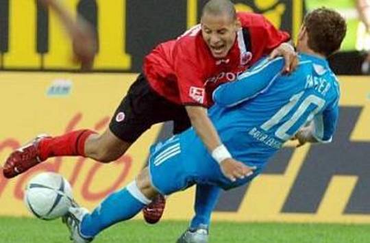 Jermaine Jones of Eintracht Frankfurt against Paul Freier of Bayer Leverkusen (AFP)