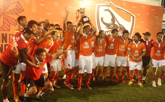 Nix [sixth from the right] celebrates winning a pre-season tournament with his new club.
