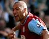 EPL: John Carew and Wilfred Bouma, Aston Villa - Newcastle United (PA)