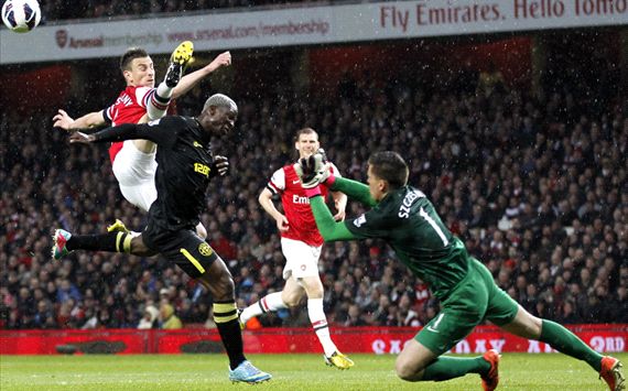 EPL - Arsenal v Wigan Athletic, Laurent Koscielny, Wojciech Szczesny and Arouna Kone