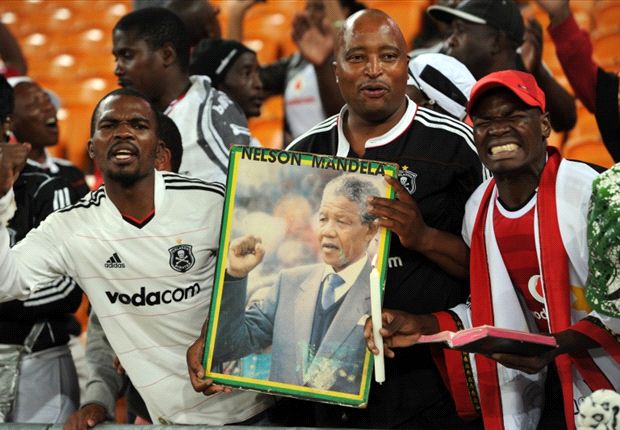 South African football fans with a poster of Nelson Mandela
