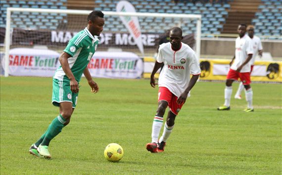 Kenya midfielder Peter Opiyo andf John Obi Mikel of Nigeria.