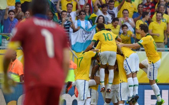 Brazil players celebrate after a goal