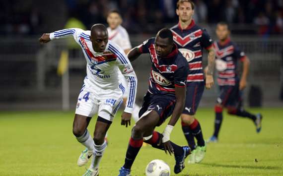 Lyon defender Mouhamadou Dabo views with Bordeaux forward Cheick Diabate