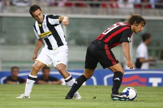 Tim Cup: Milan-Juventus, Marchionni - Pirlo (Foto Grazia Neri)
