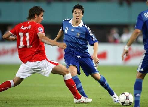 Martin Harnik (Austria) in action against Samir Nasri (France)