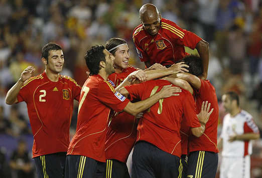 European champions Spain celebrating one of the four goals put past Armenia in yesterday's World Cup qualifier.