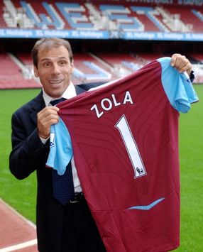 Gianfranco Zola looking full of surprise as he poses for photos following his unveiling as the new West Ham United boss.