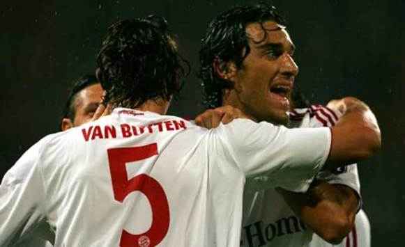 Luca Toni and Daniel van Buyten celebrate a goal - surprisingly scored by the latter - in Bayern's 1-0 win over Steaua Bucharest, capping a successful return to the Champions League.