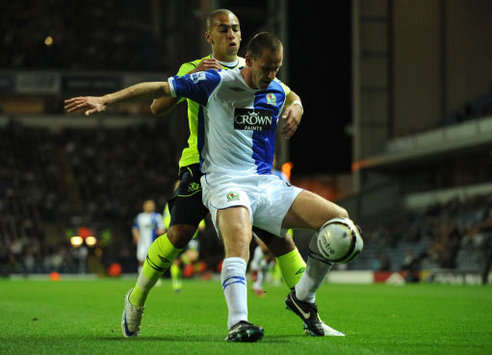 CC: Andre Ooijer and James Vaughan, Blackburn Rovers v Everton (PA)