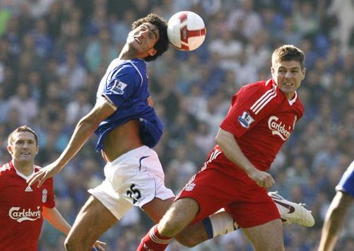 The friendly derby: Everton's new big-money signing Marouane Fellaini and Liverpool captain Steven Gerrard during the Reds' 2-0 win in the Merseyside derby.