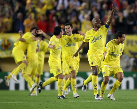 Mellow Yellow: relief for Villarreal as they celebrate following the only goal of the game in a 1-0 win over Celtic in the Champions League.
