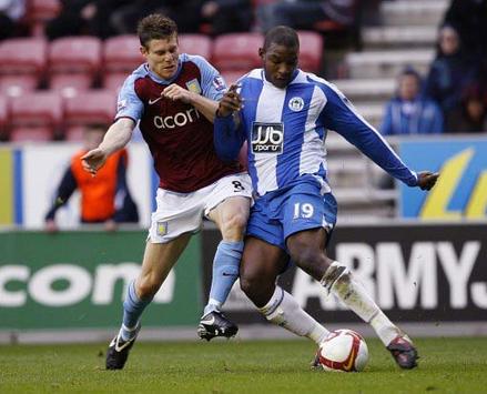 EPL: James Milner - Titus Bramble, Wigan Athletic v Aston Villa (PA)