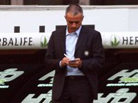 Inter manager José Mourinho makes notes during his side's goalless draw with Torino