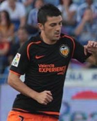 Valencia striker David Villa keeps his eye on the ball
