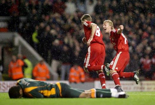 EPL: Liverpool skipper Steven Gerrard wheels away after netting his penalty against Portsmouth. (PA)